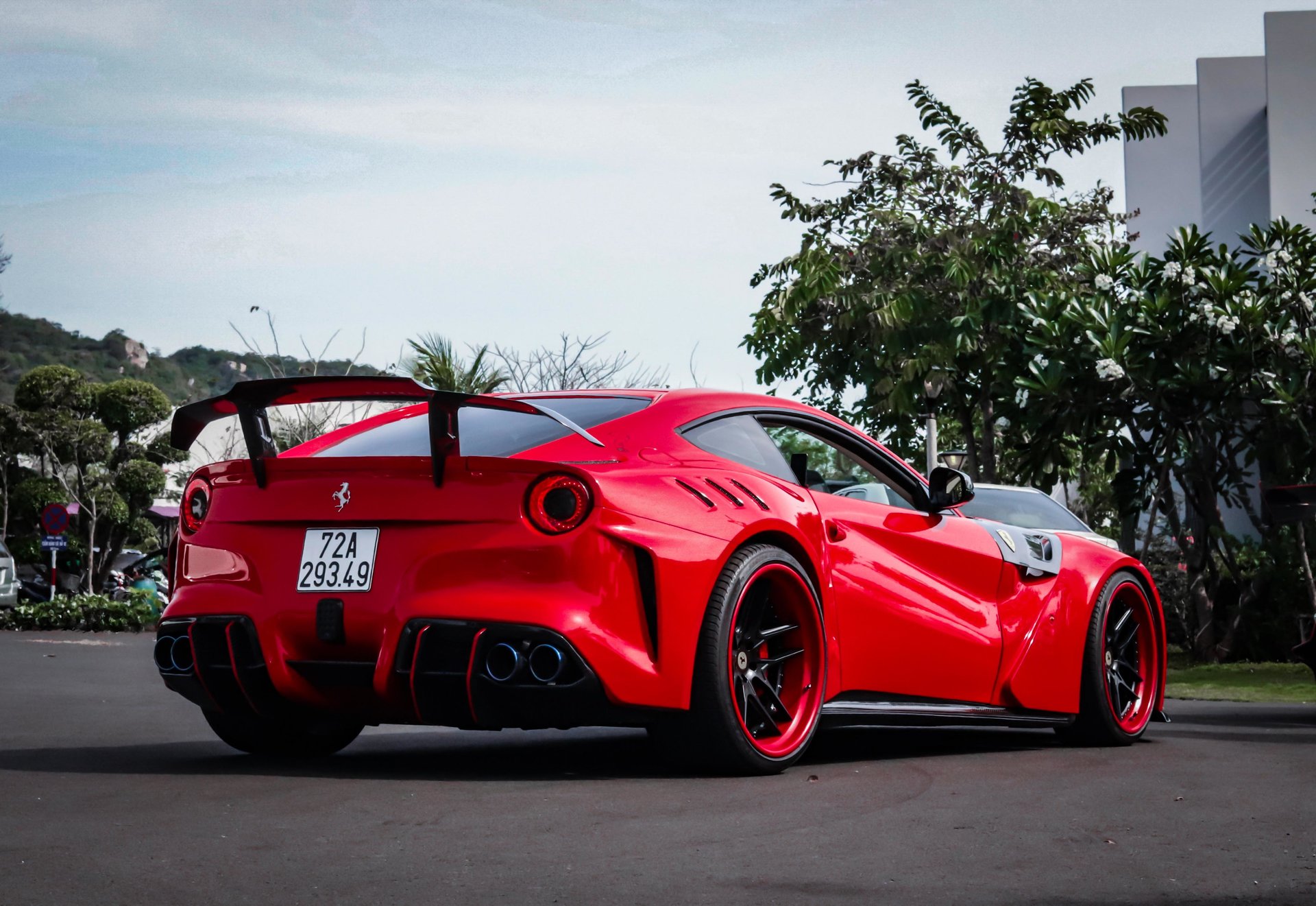 Ferrari F12 wrapped in Avery SW Gloss Cardinal Red vinyl